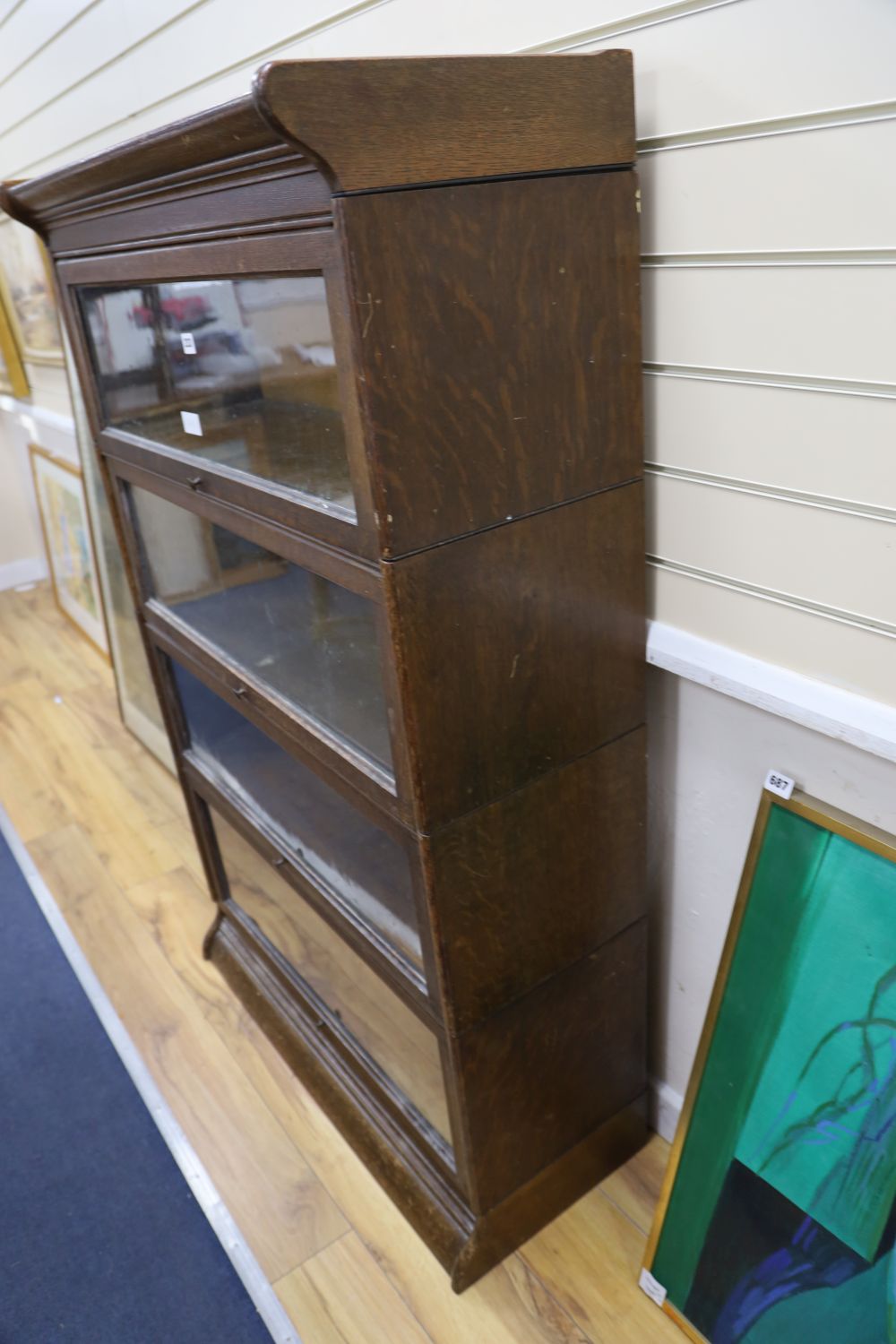 An early 20th century oak Globe Wernicke-style oak four section bookcase, width 87cm depth 36cm height 140cm